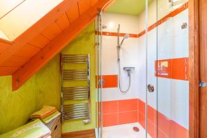 a bathroom with a shower and a tub at Lodjadis in Labaroche +17 photos
