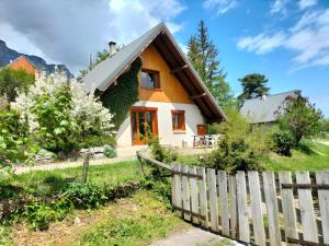 a house with a fence in front of it at Chartrousin in Saint-Hilaire
