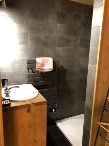 a bathroom with a sink and a shower at Chalet L'envers in Champagny-en-Vanoise +24 photos