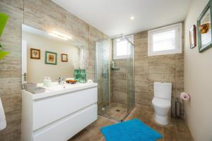 a bathroom with a shower and a sink and a toilet at Finca Es Pi in Llucmajor