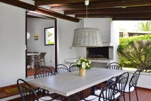a dining room with a table and chairs at Villa Bua in Costa Rei