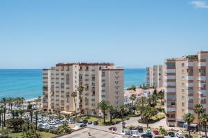 an aerial view of apartment buildings and the ocean at Estudios 79 in Torrox