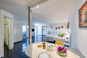 a bedroom with a bed and a table in a room at Residence Margherita in Ugento