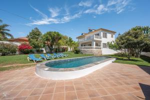 a house with a swimming pool in the yard at Marbella Villa 16 Persons -Pool in Marbella