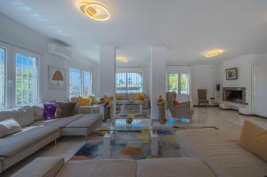 a living room with a couch and a table at Marbella Villa 16 Persons -Pool in Marbella