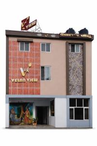 a model of a building with a sign on it at Velan view in Palni
