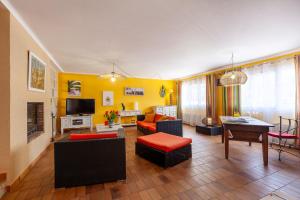 a living room with a couch and a table at Villa L'Acanthe in Six-Fours-les-Plages