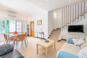 a living room with a couch and a table at Can Marineta in Palma de Mallorca