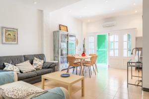 a living room with a couch and a table at Can Marineta in Palma de Mallorca