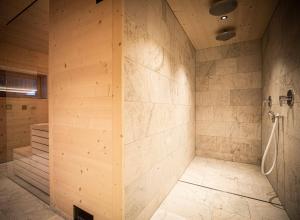 a large bathroom with a shower and a tub at Burgfrieder Mühle in Rasun di Sopra +34 photos