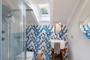 a bathroom with a toilet and a sink and a shower at Saint Claude in Marina di Andora +63 photos