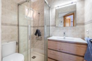 a bathroom with a toilet and a sink and a shower at Que Bo in Alcudia +19 photos