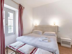 a bedroom with two beds and a window at Delicious House Michelangelo in Cavaion Veronese