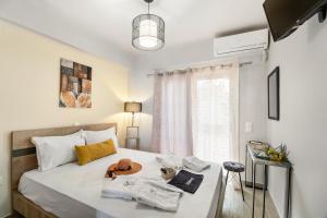 a bedroom with a bed and a window at Evagelia Luxury Apartment 2 in Nikiana +18 photos