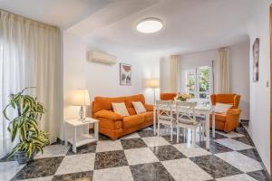 a living room with a couch and a table at Casa Ramirez in Güéjar-Sierra