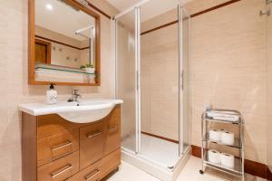 a bathroom with a sink and a shower at Casa Ramirez in Güéjar-Sierra +20 photos