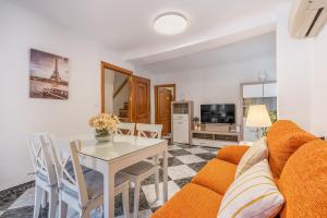 a living room with a couch and a table at Casa Ramirez in Güéjar-Sierra