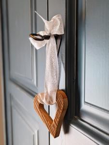 a pair of shoes hanging on a door at Chalet Sonnberg Bramberg in Bramberg am Wildkogel +35 photos