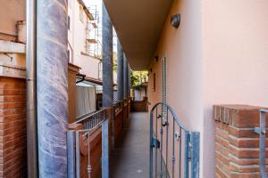 an empty hallway of a building with a gate at Aria in Follonica