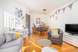 a living room with a couch and a table at Superbe Duplex en centre ville in Douarnenez