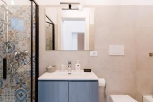 a bathroom with a sink and a shower at Casa Margherita in Matino +16 photos