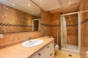 a bathroom with a sink and a shower and a toilet at Olympo in Port de Pollensa +23 photos