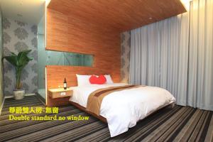 Кровать или кровати в номере Yoai Hotel