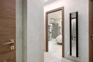a hallway with two mirrors and a bedroom at Double room - Myaostaproject in Aosta +21 photos
