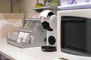 a microwave oven sitting on a counter next to at Double room - Myaostaproject in Aosta