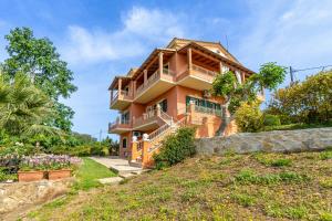 a house on a hill with a yard at Even Ezer with private pool in Pouládes
