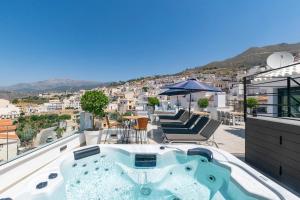 a hot tub on the roof of a house at Luxury apartment in Cómpeta in Cómpeta