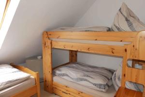 a couple of bunk beds in a room at Ferienwohnung Nordenau in Schmallenberg