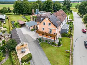 an aerial view of a large house with a driveway at Ferienwohnung Gruber in Bodenwöhr