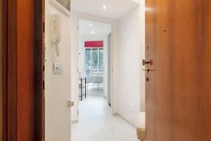 a hallway with a door leading into a room at Margherita - Fronte Mare in Rapallo +19 photos