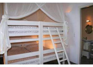 a white bunk bed with a ladder in a room at Villa Galazio in Kampos Paros