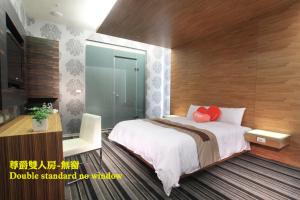 Ліжко або ліжка в номері Yoai Hotel