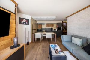 a living room with a couch and a table at Residence Latemarblick in Nova Levante