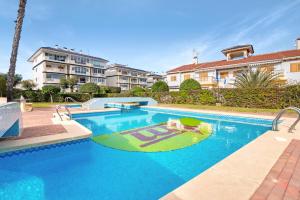 a swimming pool in the middle of a building at Parque Mar V in La Mata