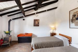 a bedroom with two beds in a room at The Gallery - Unità 16 in Baiardo
