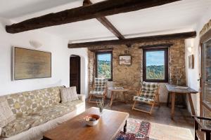 a living room with a couch and a table at The Gallery - Unità 16 in Baiardo