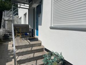 a set of stairs leading up to a house at Dreams im Erdgeschoss in Koetz 