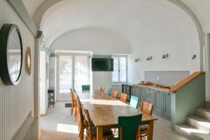 a dining room with a table and chairs at Chambres d'hôtes - Chez Antho in Betton-Bettonet