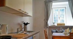 a kitchen with a sink and a counter top at Priestereck in Obernberg am Brenner