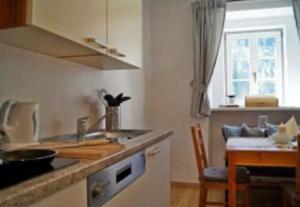 a kitchen with a sink and a counter top at Priestereck in Obernberg am Brenner