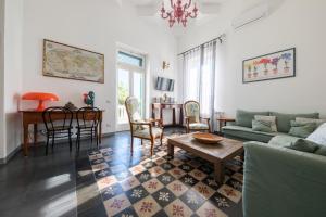 a living room with a couch and a table at La Casa Bianca in Lipari