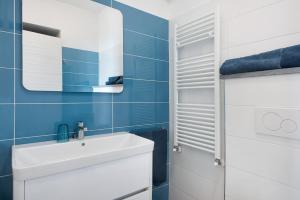 a bathroom with a white sink and a mirror at Casa mare montaretto 2 in Bonassola +20 photos