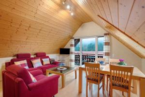 a living room with a couch and a table at Grundhof in Oberprechtal