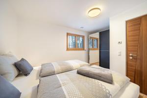 a bedroom with a bed with two pillows on it at Apartment Klara in Meltina