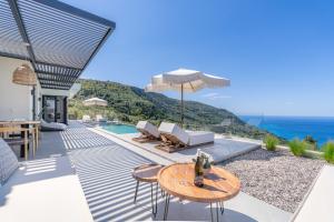 a villa with a view of the ocean at Nimbus Villas in Kalamitsi