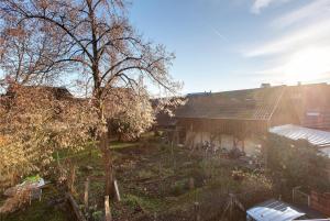 a house with a yard next to a building at Ferienwohnung Atelier in Schopfheim